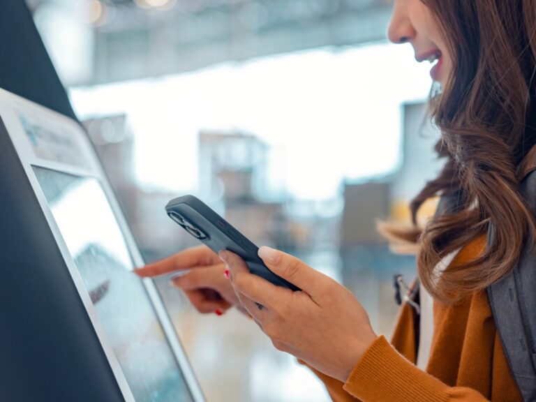 woman at self-serve kiosk